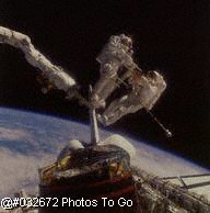 Two Astronauts in space outside shuttle